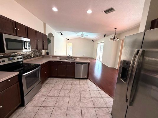 Interior, Kitchen, Recessed Lighting, Stainless Steel Appliances, Wood Texture Flooring