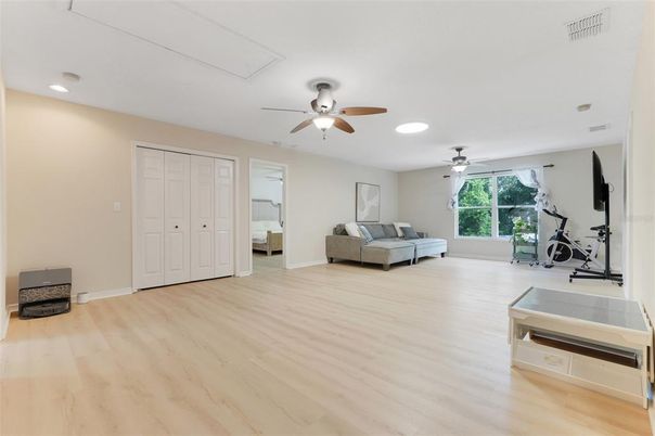 Bedroom, Fitness Equipment, Interior, Recessed Lighting, Wood Texture Flooring