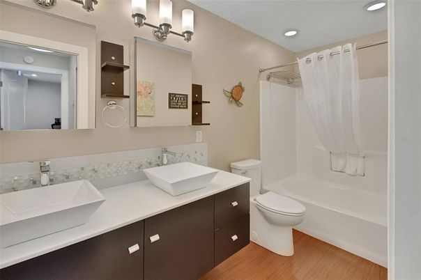 Bathroom, Dual Sink Vanities, Interior, Recessed Lighting, Wood Texture Flooring