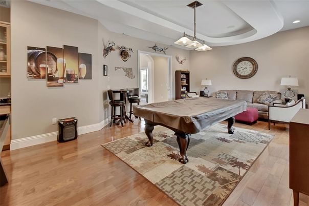 Billiard Table, Game Room, Interior, Living room, Pendant Lights, Recessed Lighting, Wood Texture Flooring