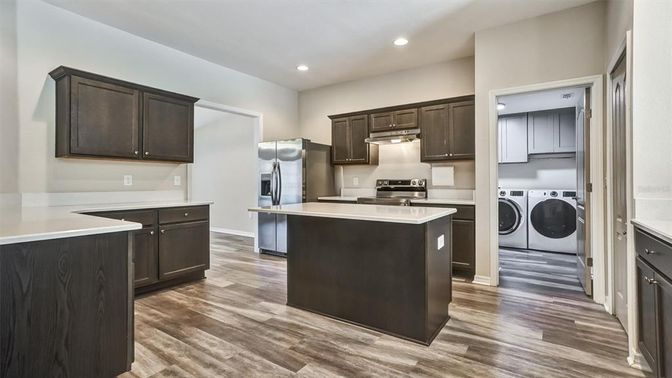 Interior, Kitchen, Recessed Lighting, Washer, Wood Texture Flooring