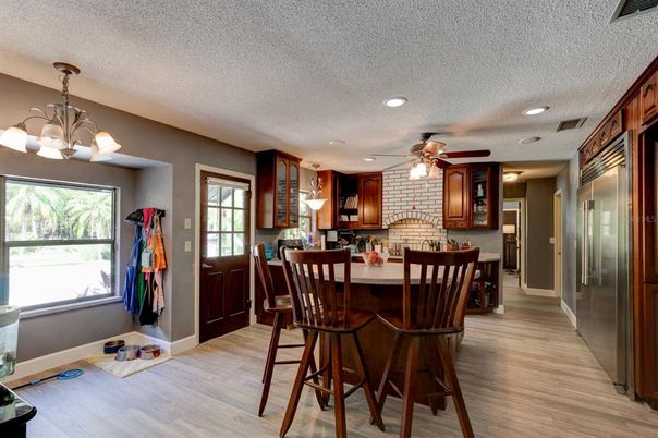 Chandelier, Dining room, Interior, Kitchen, Recessed Lighting, Stone Walls, Wood Texture Flooring