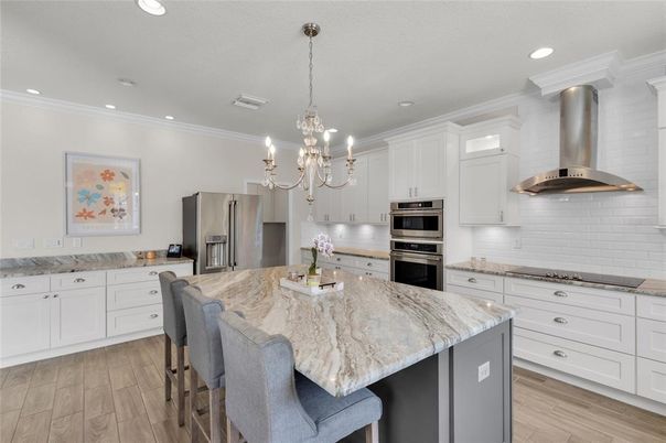 Chandelier, Interior, Kitchen, Recessed Lighting, Stainless Steel Appliances, Wood Texture Flooring