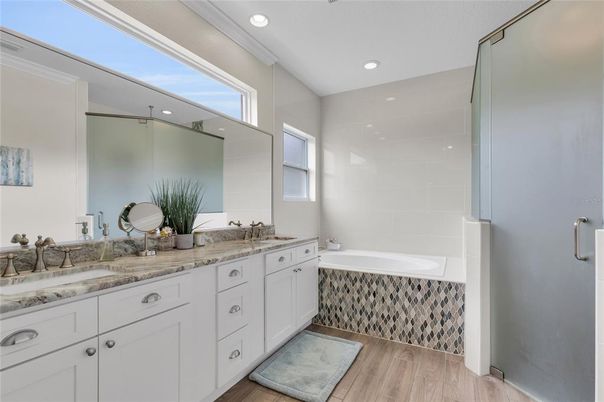 Bathroom, Dual Sink Vanities, Glass Shower, Interior, Recessed Lighting, Wood Texture Flooring