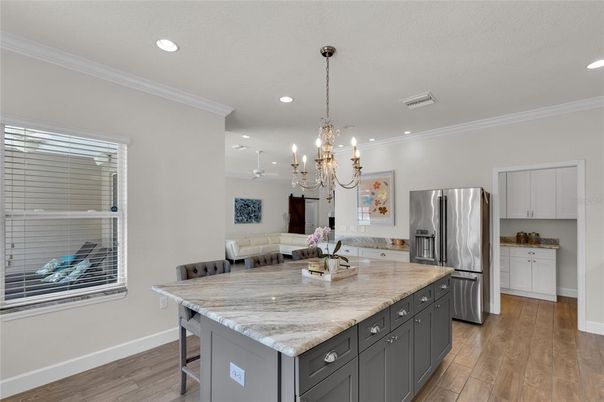 Chandelier, Dining room, Interior, Kitchen, Recessed Lighting, Stainless Steel Appliances, Wood Texture Flooring
