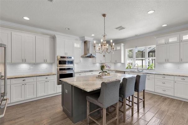 Chandelier, Interior, Kitchen, Recessed Lighting, Stainless Steel Appliances, Wood Texture Flooring
