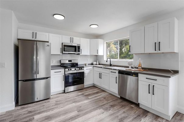 Interior, Kitchen, Recessed Lighting, Stainless Steel Appliances, Wood Texture Flooring