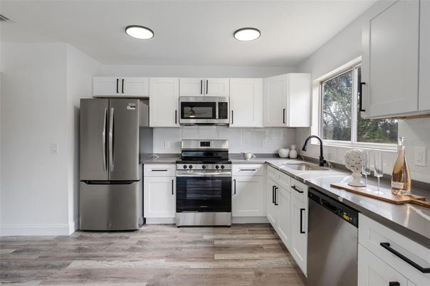 Interior, Kitchen, Recessed Lighting, Stainless Steel Appliances, Wood Texture Flooring