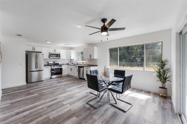 Dining room, Interior, Kitchen, Recessed Lighting, Stainless Steel Appliances, Wood Texture Flooring