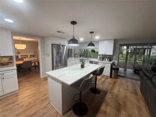 Dining room, Interior, Kitchen, Pendant Lights, Recessed Lighting, Stainless Steel Appliances, Wood Texture Flooring