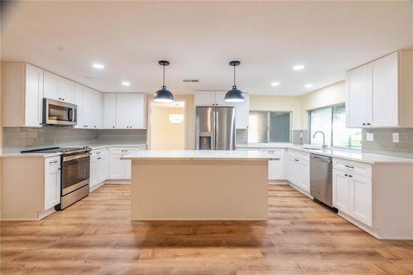 Interior, Kitchen, Pendant Lights, Recessed Lighting, Stainless Steel Appliances, Wood Texture Flooring