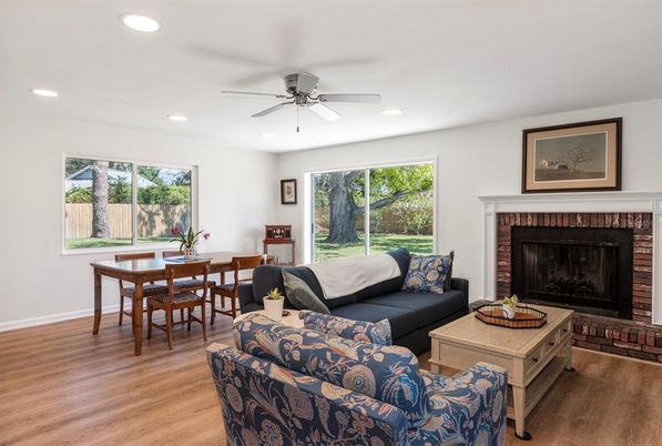 Dining room, Fireplace, Interior, Living room, Recessed Lighting, Wood Texture Flooring