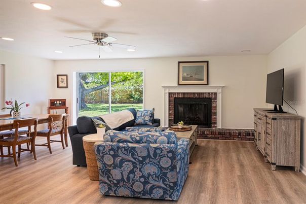 Dining room, Fireplace, Interior, Living room, Recessed Lighting, Wood Texture Flooring