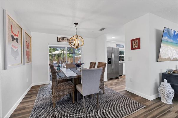 Dining room, Interior, Kitchen, Pendant Lights, Recessed Lighting, Stainless Steel Appliances, Wood Texture Flooring