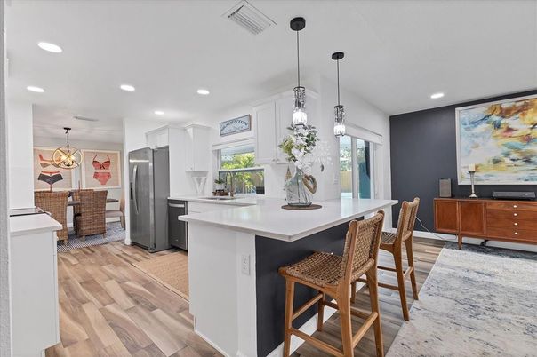 Dining room, Interior, Kitchen, Pendant Lights, Recessed Lighting, Stainless Steel Appliances, Wood Texture Flooring