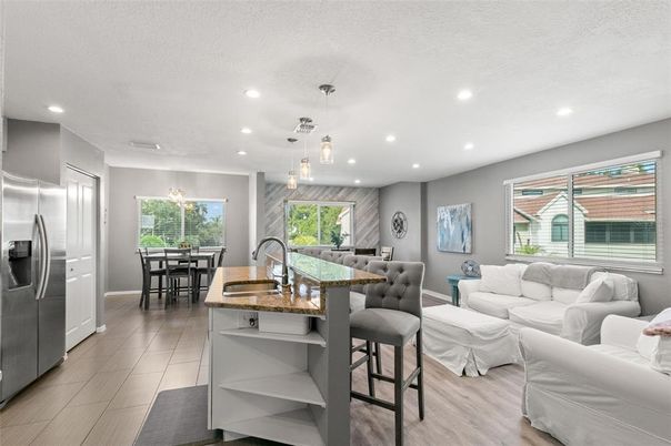 Dining room, Interior, Kitchen, Living room, Pendant Lights, Recessed Lighting, Stainless Steel Appliances, Wood Texture Flooring
