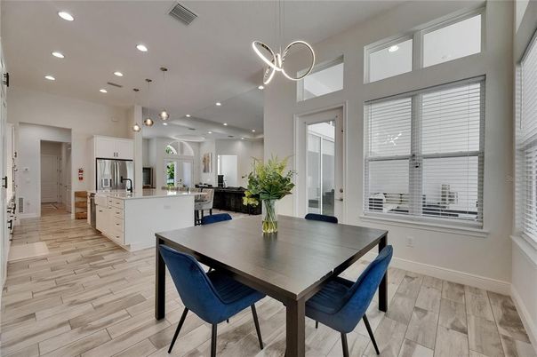 Dining room, Interior, Kitchen, Pendant Lights, Recessed Lighting, Stainless Steel Appliances, Wood Texture Flooring