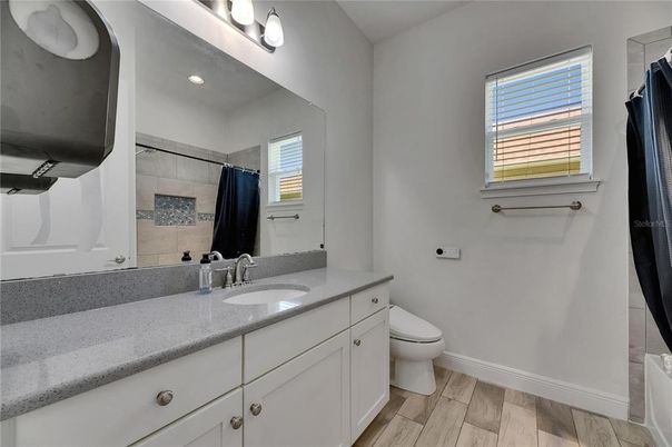 Bathroom, Dual Sink Vanities, Interior, Recessed Lighting, Wood Texture Flooring
