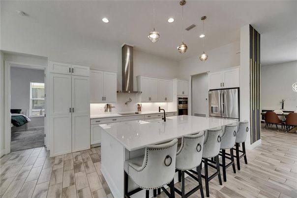 Dining room, Interior, Kitchen, Pendant Lights, Recessed Lighting, Stainless Steel Appliances, Wood Texture Flooring