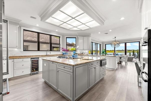 Chandelier, Dining room, Interior, Kitchen, Recessed Lighting, Stainless Steel Appliances, Water, Wood Texture Flooring