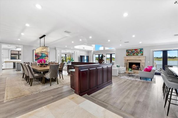 Dining room, Fireplace, Interior, Living room, Pendant Lights, Recessed Lighting, Water, Wood Texture Flooring