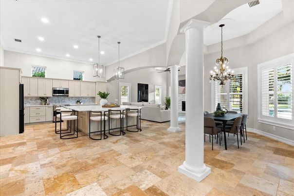 Chandelier, Dining room, Fireplace, Interior, Kitchen, Living room, Pendant Lights, Recessed Lighting, Stainless Steel Appliances