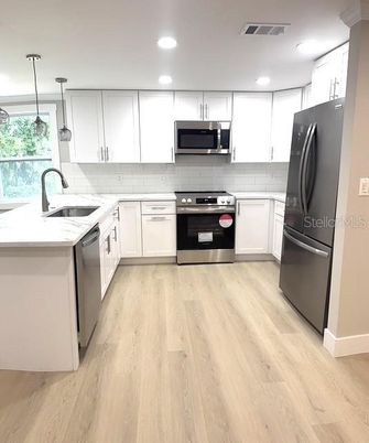 Interior, Kitchen, Pendant Lights, Recessed Lighting, Stainless Steel Appliances, Wood Texture Flooring