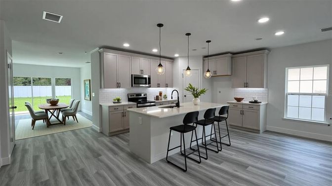 Dining room, Interior, Kitchen, Pendant Lights, Recessed Lighting, Stainless Steel Appliances, Wood Texture Flooring
