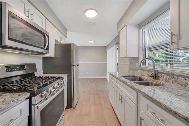 Interior, Kitchen, Recessed Lighting, Stainless Steel Appliances, Wood Texture Flooring