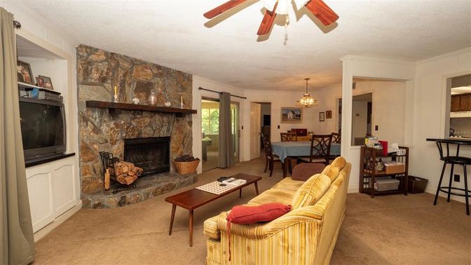 Chandelier, Dining room, Fireplace, Interior, Living room, Stone Walls