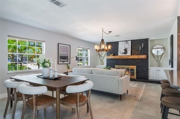 Chandelier, Dining room, Fireplace, Interior, Living room, Stone Walls
