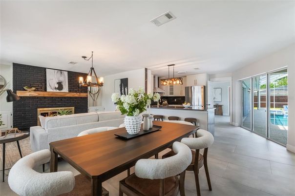Dining room, Fireplace, Interior, Kitchen, Living room, Pendant Lights, Stainless Steel Appliances, Stone Walls