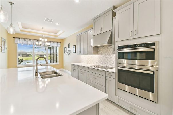 Chandelier, Interior, Kitchen, Pendant Lights, Recessed Lighting, Stainless Steel Appliances, Wood Texture Flooring