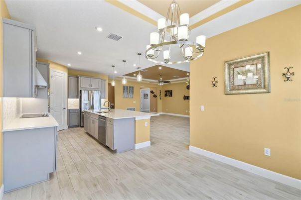 Chandelier, Interior, Kitchen, Pendant Lights, Recessed Lighting, Stainless Steel Appliances, Wood Texture Flooring