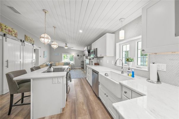 Dining room, Interior, Kitchen, Living room, Pendant Lights, Recessed Lighting, Stainless Steel Appliances, Wood Texture Flooring