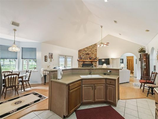 Dining room, Fireplace, Interior, Kitchen, Pendant Lights, Recessed Lighting, Stone Walls, Wood Texture Flooring