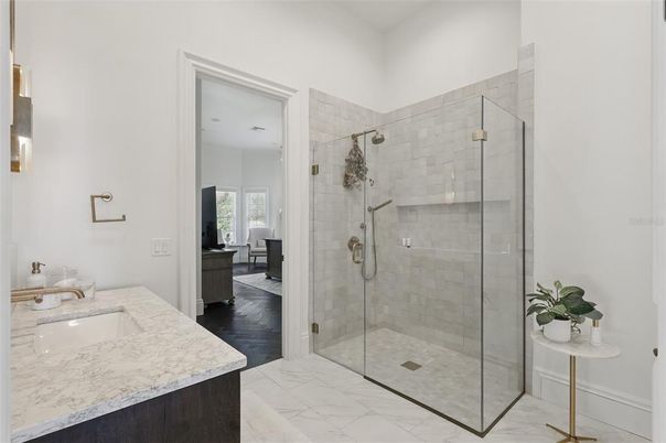 Bathroom, Dual Sink Vanities, Glass Shower, Interior, Marble, Wood Texture Flooring