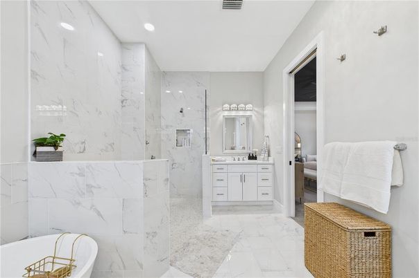 Bathroom, Dual Sink Vanities, Free Standing Baths, Interior, Marble, Marble Walls, Recessed Lighting