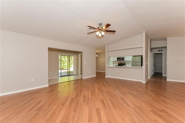 Empty room, Interior, Kitchen, Stainless Steel Appliances, Wood Texture Flooring