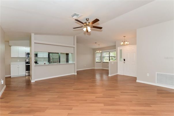 Chandelier, Empty room, Interior, Kitchen, Pendant Lights, Stainless Steel Appliances, Wood Texture Flooring