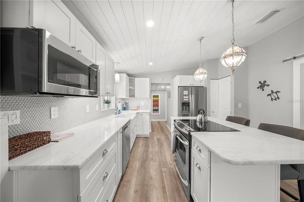 Interior, Kitchen, Pendant Lights, Recessed Lighting, Stainless Steel Appliances, Wood Texture Flooring