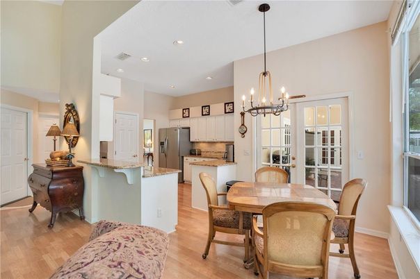 Chandelier, Dining room, Interior, Kitchen, Pendant Lights, Recessed Lighting, Stainless Steel Appliances, Wood Texture Flooring
