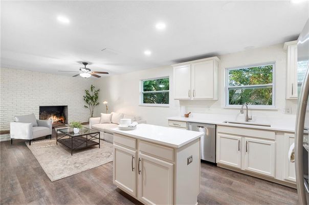 Fireplace, Interior, Kitchen, Living room, Recessed Lighting, Stone Walls, Wood Texture Flooring