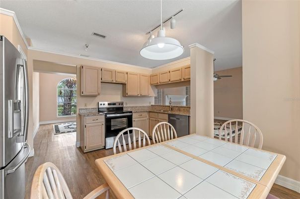 Dining room, Interior, Kitchen, Stainless Steel Appliances, Tile Countertops, Wood Texture Flooring
