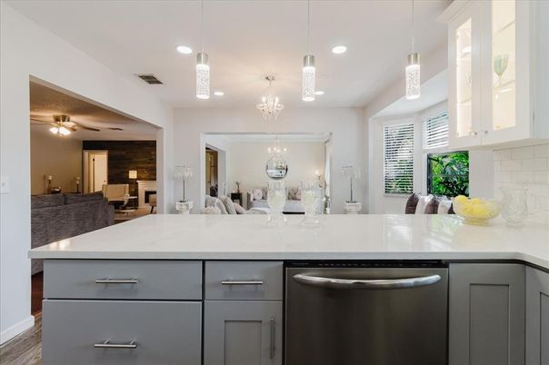 Chandelier, Dining room, Interior, Kitchen, Pendant Lights, Recessed Lighting, Stainless Steel Appliances, Wood Texture Flooring