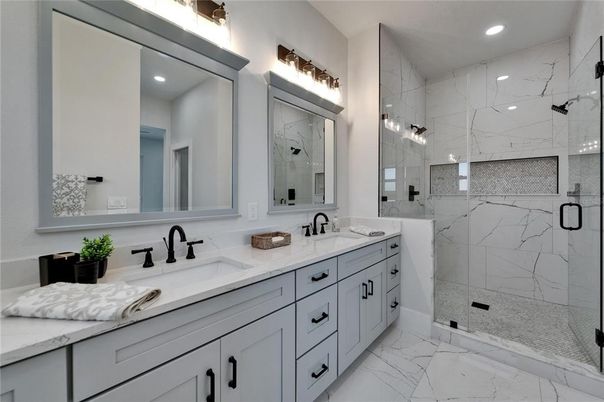 Bathroom, Dual Sink Vanities, Glass Shower, Interior, Marble, Marble Walls, Recessed Lighting