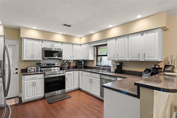 Interior, Kitchen, Recessed Lighting, Stainless Steel Appliances, Wood Texture Flooring