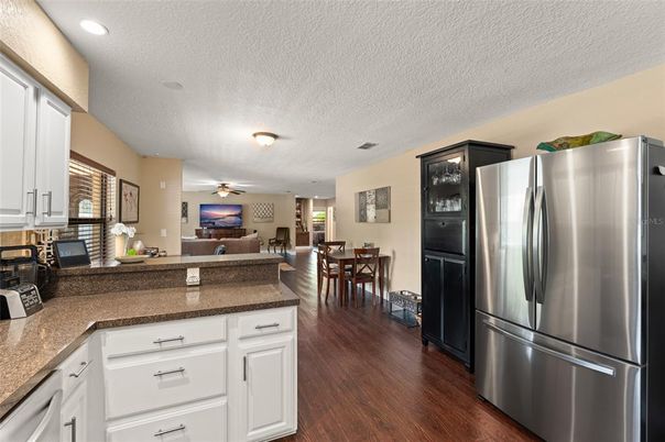 Dining room, Interior, Kitchen, Recessed Lighting, Stainless Steel Appliances, Wood Texture Flooring