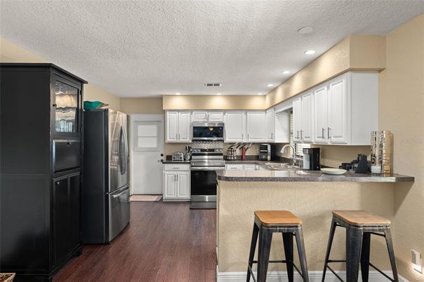 Interior, Kitchen, Recessed Lighting, Stainless Steel Appliances, Wood Texture Flooring
