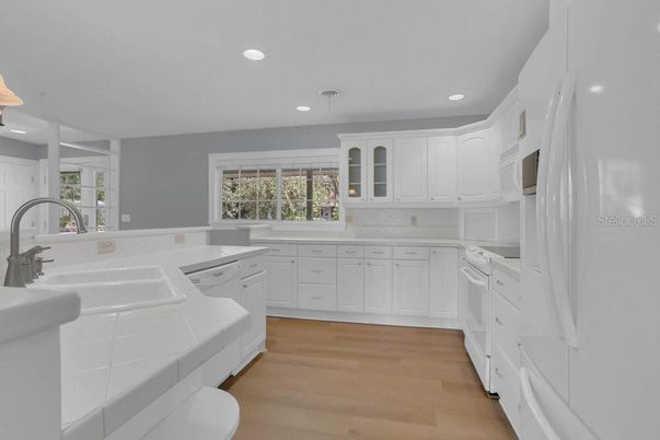 Interior, Kitchen, Recessed Lighting, Tile Countertops, Wood Texture Flooring